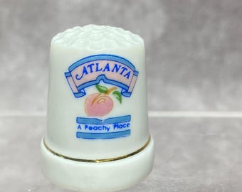 ミネソタ州のお土産、金の縁取りと州地図のデザインが施された磁器の