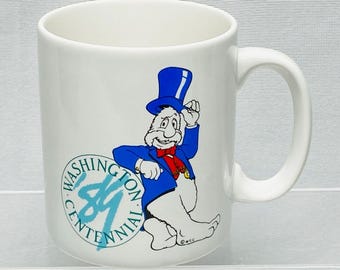 Washington Centennial 1989 White Ceramic Mug with Cartoon Character Design 10 Oz