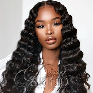 May include: A woman with long, black, wavy hair. She is wearing a white shirt and has a neutral expression on her face.