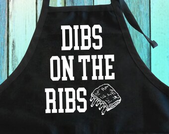 Dibs On The Ribs BBQ Apron: Cotton-Poly Blend with Pockets