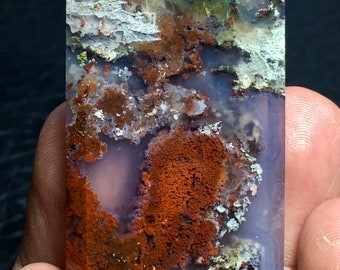 May include: A polished, rectangular slab of agate with a variety of colours and patterns, including brown, white, and green. The agate has a smooth, polished surface and a translucent appearance.