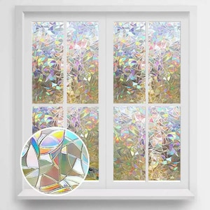 May include: A white framed window with eight panes of iridescent, stained-glass-like film applied. The film refracts light into a spectrum of colors, creating a decorative and privacy-enhancing effect. A close-up shows the film's intricate pattern.