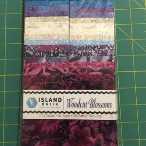 Woodcut Blossoms - Island Batiks precut 2 1/2" strips (40 pieces) - 20 fabric designs - Blues/Purples/Cream Batik fabrics