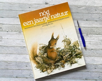 Libro de naturaleza con imágenes de Marjolein Bastin, título: Otro año de naturaleza en holandés.