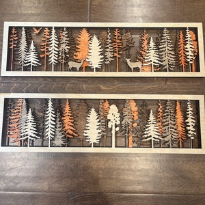 File di taglio laser per appendere la parete a strati della foresta. 2 design (cervi e alberi) 4 strati 5,5" x 19" Solo tipo di file SVG. Nessun prodotto fisico.