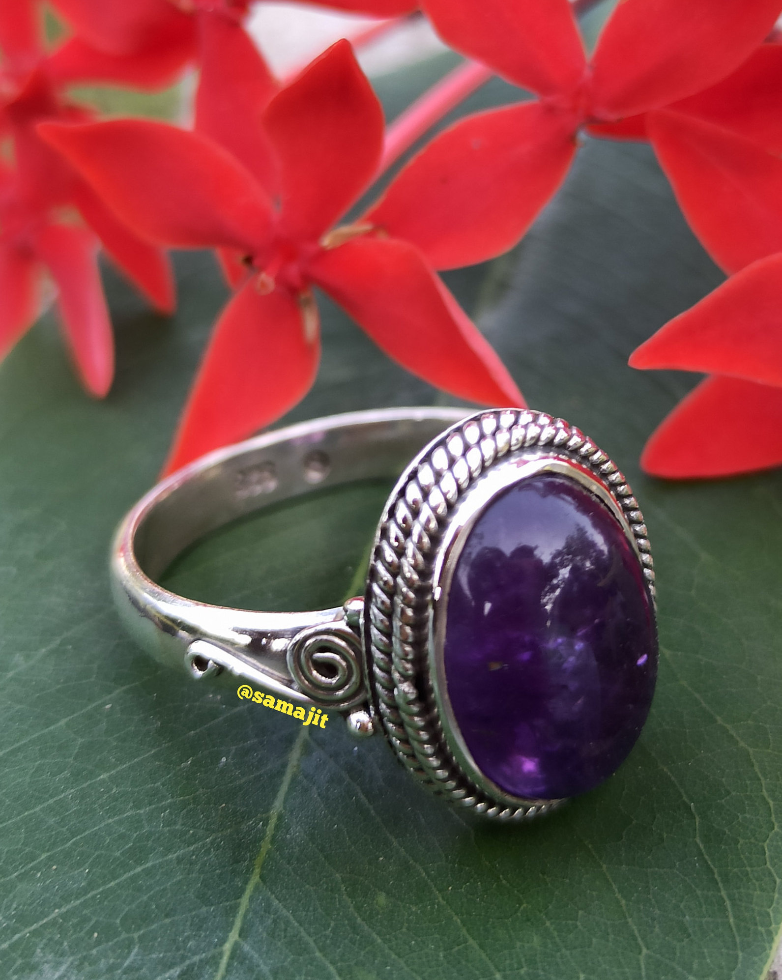 Satin Silver plated oval ring with Amethyst Cabochon adjustable. 