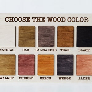 May include: A wood color chart with 10 different wood stain colors. The colors are: Natural, Oak, Palisander, Teak, Black, Walnut, Cherry, Beech, Wenge, and Alder.