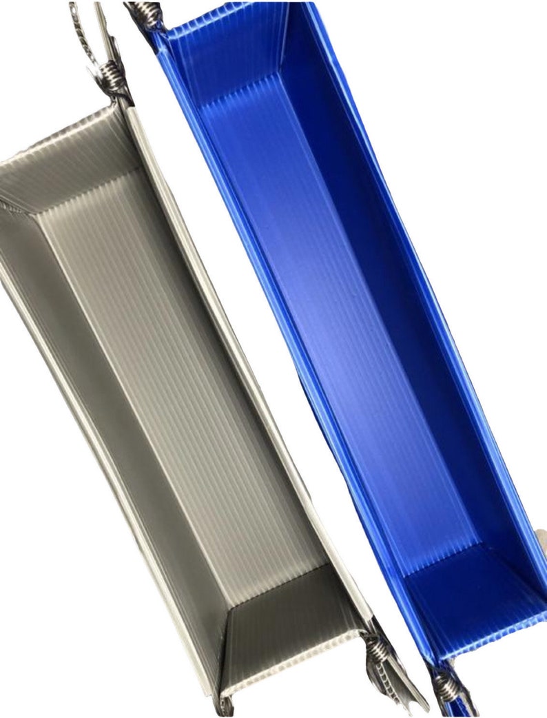 May include: Two plastic trays, one gray and one blue, with a corrugated texture. The trays are folded and have a handle on each end.