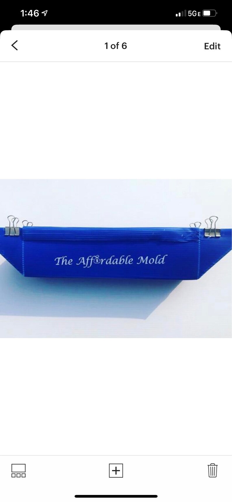May include: A blue plastic mold with the text "The Affordable Mold" printed on it. The mold is held together with binder clips.