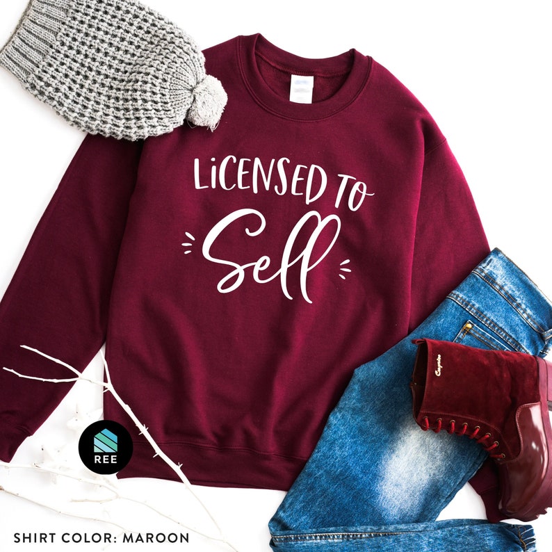 May include: Maroon sweatshirt with the text "Licensed to Sell" in white lettering.