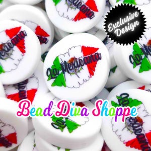 May include: A close-up of white round beads with a Mexican flag design and the text "La Mexicana". The beads are scattered on a white surface. The text "Bead Diva Shoppe" is visible in the bottom center of the image.