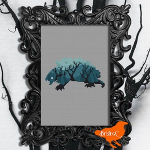 May include: A framed cross-stitch featuring a teal and blue creature with a tree-like design on its back, set against a gray background. The frame is ornate black. The image includes the text "BYMEGC".