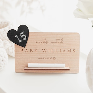 May include: A wooden countdown block with a chalkboard heart that says "15" and the text "weeks until BABY WILLIAMS arrives".