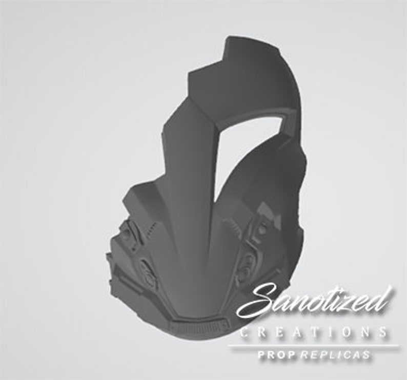 May include: A gray 3D printed helmet with a visor and intricate details. The helmet has a futuristic design and is made of a smooth, matte material.