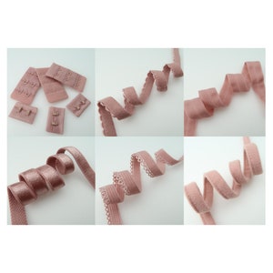 May include: Assortment of pink elastic bra straps with different textures and styles. Some straps have a scalloped edge, while others are smooth. The straps are all approximately 1 inch wide.
