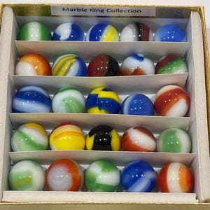 May include: A collection of 20 colorful marbles in a white box with the text "Marble King Collection". The marbles are arranged in rows and are a variety of colors, including red, blue, green, yellow, and white.