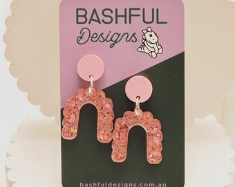 Get Down, Get Glittered pretty pink arch earrings