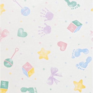 May include: A white background with a repeating pattern of pastel coloured baby-themed illustrations. The illustrations include stars, hearts, bows, rattles, footprints, and blocks. The background is dotted with small white dots.
