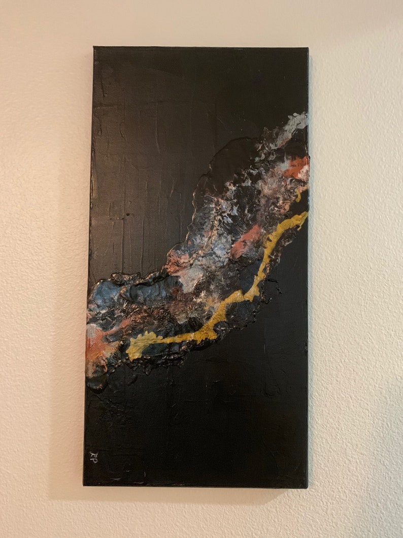 May include: Abstract painting on canvas with a black background and a textured, flowing design in shades of gold, white, and pink.