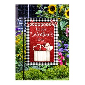 May include: A red and white checkered garden flag with a red glitter background. The flag says "Happy Valentine's Day" and has a basket of red hearts with white polka dots.