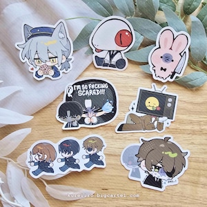 May include: A collection of colorful anime-style stickers featuring various characters and designs. The stickers include a cat-eared character, a character with a single eye, a bunny with a knife, and characters with the text "I'M SO F*CKING SCARED!!!" and "FML...!".
