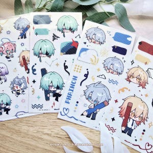 Könnte beinhalten: Eine Sammlung von Aufklebern im Anime-Stil mit Charakteren mit bunten Haaren und Outfits. Einige Aufkleber enthalten Bleistifte, Sprechblasen und den Text "PHRAINON". Die Aufkleber befinden sich auf weißem Hintergrund.