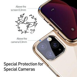 May include: A gold phone case with a raised lip around the camera lenses and screen. The case is designed to protect the phone's camera lenses and screen from scratches and bumps. The case has a clear back that shows off the phone's design. The case is also designed to be easy to grip and hold. The case is made of durable, high-quality materials. The case is compatible with the iPhone 13 Pro Max. The case is available in a variety of colors.