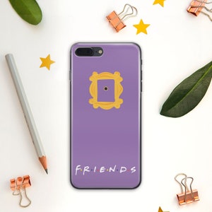 May include: Purple phone case with a yellow frame and the words "FRIENDS" printed on the bottom.