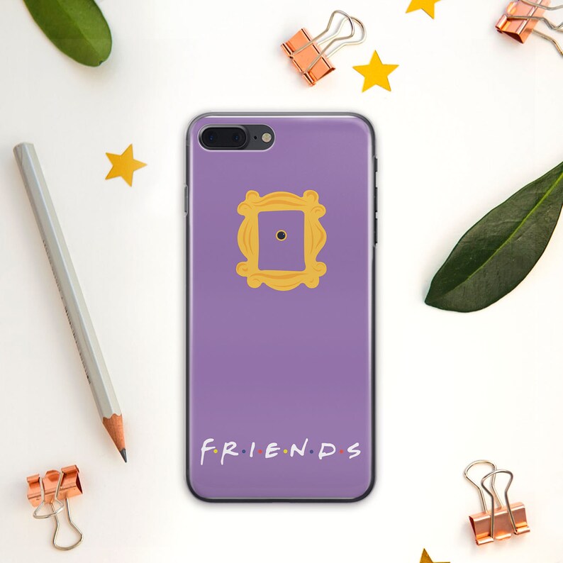 May include: Purple phone case with a yellow frame and the words "FRIENDS" printed on the bottom.