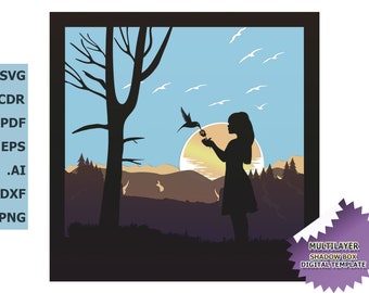 May include: A silhouette of a girl holding a flower with a hummingbird hovering nearby. The scene is set against a sunset backdrop with a forest in the background. The image is a digital template for a multilayer shadow box.