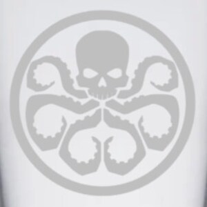 May include: A gray and white glass with a gray and white Hydra logo. The logo features a skull with a single eye and eight tentacles.