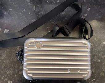 Silver metallic crossbody camera bag style hard truck case travel bag pockets straps zips 19x11cm