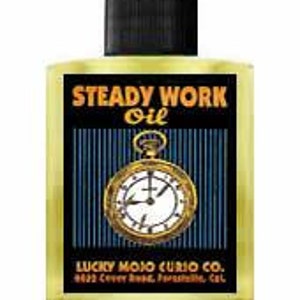 May include: A glass bottle of Steady Work Oil with a black cap and a gold pocket watch design on the label. The label also includes the text "Lucky Mojo Curio Co." and "6423 Crown Blvd.,  Paramount, Cal."