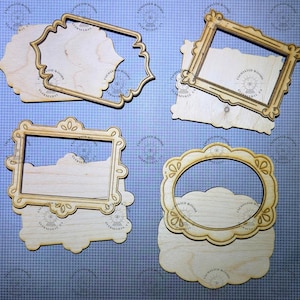 May include: Four sets of light-colored wooden frames and matching solid backings. Each set features a distinct shape, including rectangular and scalloped designs. The wood surfaces are stamped with the text Enchanted Woods, Placerville, CA.