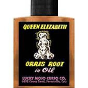 May include: A brown glass bottle with a black cap and a yellow label that reads "Queen Elizabeth Orris Root in Oil Lucky Mojo Curio Co. 6422 Colfax Ave., North Hollywood, Cal."