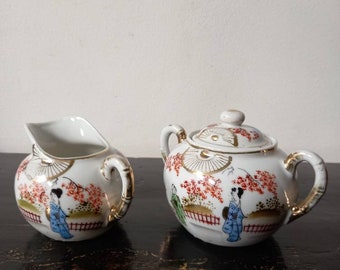 Mid Century Japanese porcelain creamer set, sugar bowl,milk jug, Geisha and garden handpainted decoration, gold,Japan 1950s-1970s