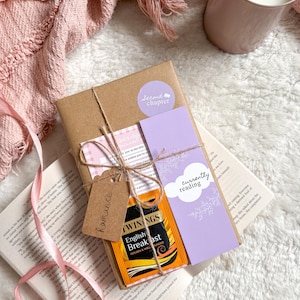 May include: A trio of ceramic mugs with a speckled, matte finish in cream, light grey, and dark grey. Each mug features a simple, minimalist design, ideal for tea or coffee.