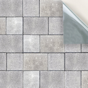 May include: A gray and white brick pattern peel and stick wallpaper. The wallpaper has a textured surface that looks like real brick.