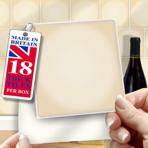 May include: A white card with a blank space for writing a message. The card is held by a hand and has a label on the left side that says "Made in Britain 18 Thick Tiles Per Box".