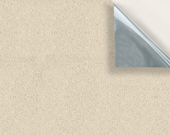 May include: A close-up of a beige carpet with a corner peeled back to reveal the backing.