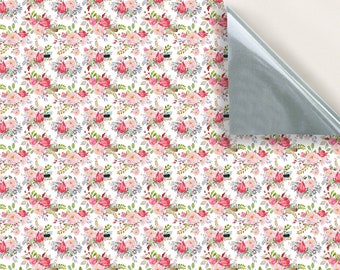 May include: White wrapping paper with a repeating pattern of pink and red watercolor flowers. The flowers are arranged in bouquets with green leaves and stems.