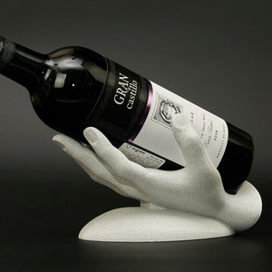 Porte-bouteille de vin à la main : casier à vin moderne pour décoration de bar