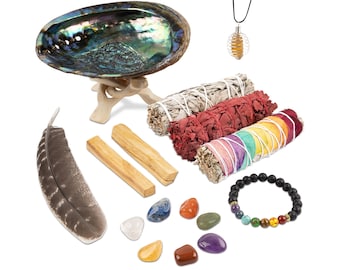May include: A smudging kit with a variety of items, including a white abalone shell, sage bundles, palo santo sticks, a feather, a crystal necklace, a chakra bracelet, and seven chakra stones.