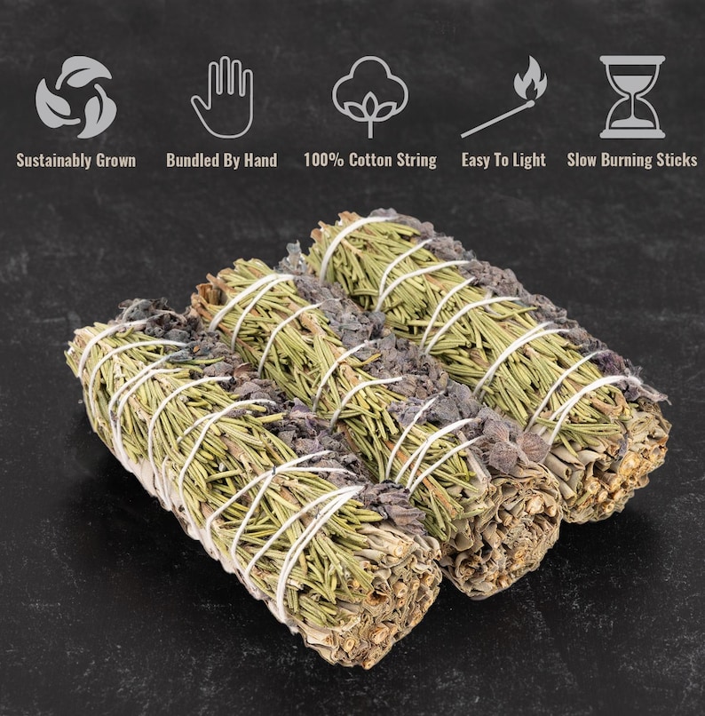 May include: Three bundles of sage smudge sticks tied with natural twine. The sticks are a light green color and have a natural, earthy look. The sticks are bundled together and ready to be used for smudging.