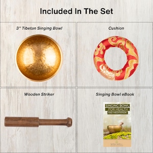 May include: A set including a 7.6 cm gold-coloured hammered Tibetan singing bowl, a red and gold patterned circular cushion, a brown wooden striker, and a digital Singing Bowl for Health and Meditation eBook with a cover image of a singing bowl.