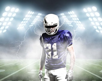 May include: A football player in a blue and white uniform stands on a green pitch with stadium lights in the background. The player is wearing a white helmet and has a determined expression on their face.