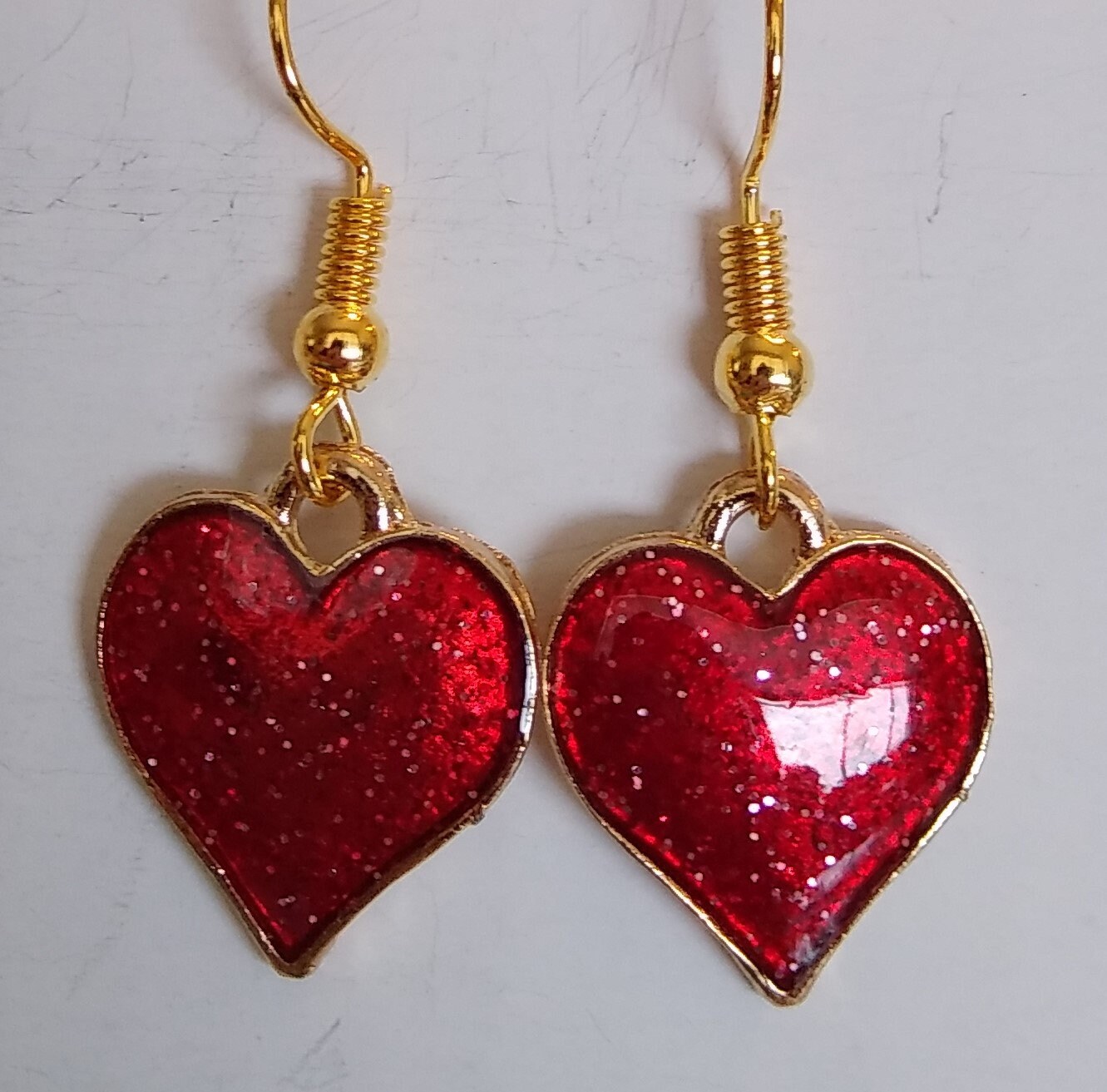 Red Glitter Metal Heart Earrings. Each Style Sold Separately. Please