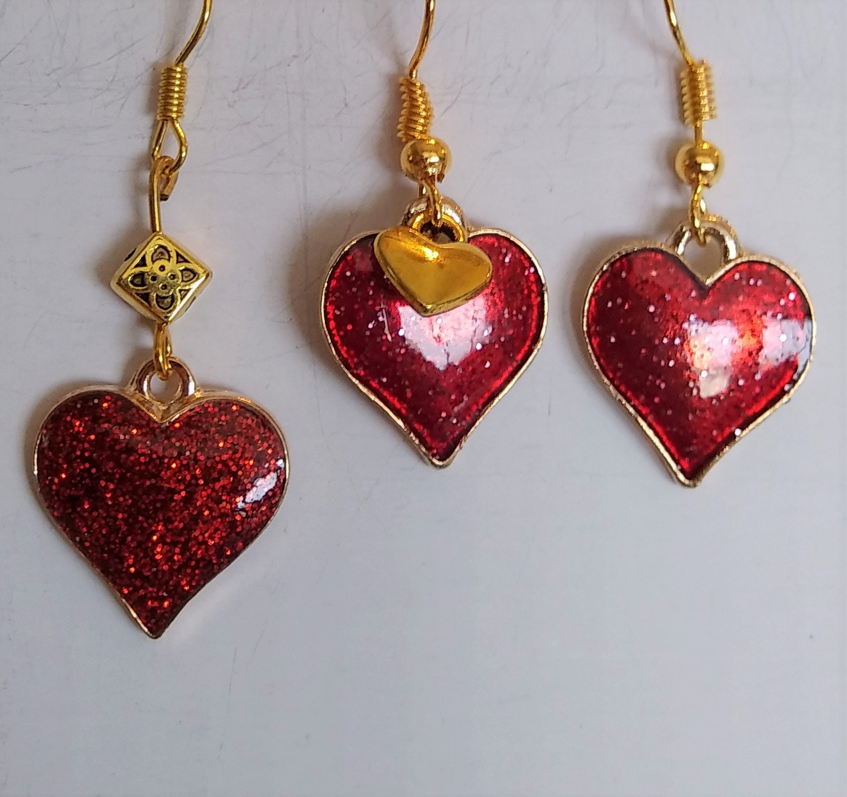 Red Glitter Metal Heart Earrings. Each Style Sold Separately. Please