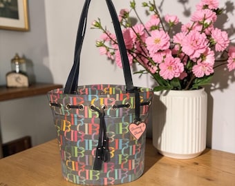 VTG Dooney & Bourke Rainbow Monogram Drawstring Tote B6877932 Black Leather 80s