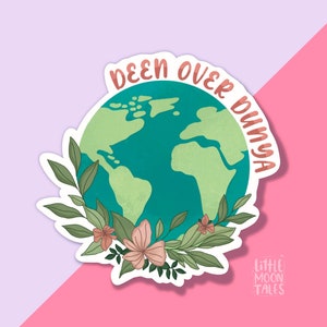 May include: A sticker featuring a green and blue globe surrounded by pink flowers and green leaves. The text "DEEN OVER DUNYA" is written in a pink cursive font around the globe.